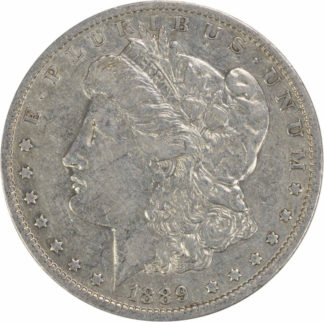 EF Grade 1889-O Morgan Dollar Uncertified US 90% Silver Coin: EF Grade 1889-O Morgan Dollar Uncertified US 90% Silver Coin This 1889-O Morgan Silver Dollar is an uncertified, circulated coin minted in New Orleans. It is composed of 90% silver and 10% copper, fea