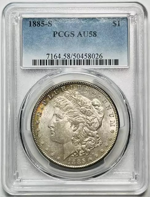 1885 S Morgan Silver Dollar Certified PCGS AU 58: 1885 S Morgan Silver Dollar Certified PCGS AU 58 This 1885 S Morgan Silver Dollar is certified by PCGS with a grade of AU 58, indicating it has been circulated but remains in excellent condition. Mint