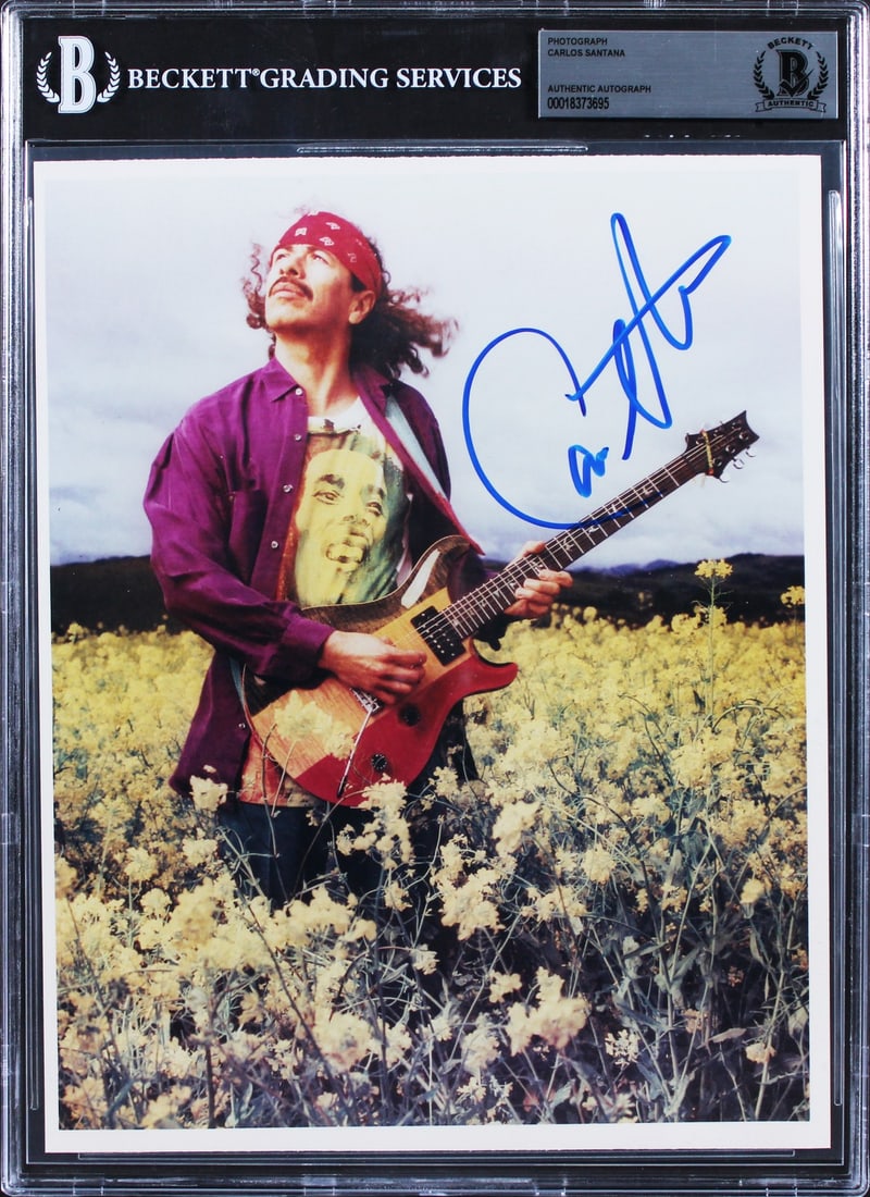 Carlos Santana Signed 8x10 Photo Beckett Authenticated Slabbed: Carlos Santana Signed 8x10 Photo Beckett Authenticated Slabbed This is an authentic autographed vertical color 8x10 photo of Carlos Santana, personally signed by the legendary musician himself. The ph