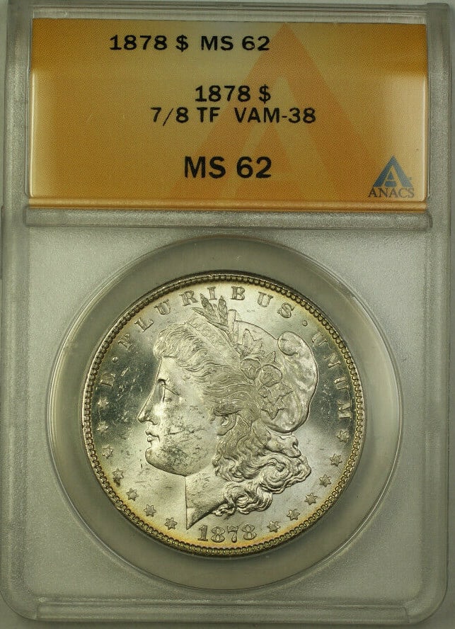 ANACS MS 62 1878 VAM-38 7/8 Tail Feathers Morgan Silver Dollar: ANACS MS 62 1878 VAM-38 7/8 Tail Feathers Morgan Silver Dollar This is an 1878 Morgan Silver Dollar graded MS 62 by ANACS. The coin is uncirculated and features the VAM-38 variety with 7/8 tail feathe