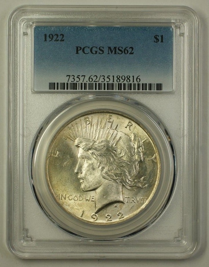 Peace Dollar 1922 Silver Coin Graded MS62 by PCGS: Peace Dollar 1922 Silver Coin Graded MS62 by PCGS This is a 1922 Peace Silver Dollar $1 coin from the United States, minted in Philadelphia. The coin is composed of silver and is certified uncirculate