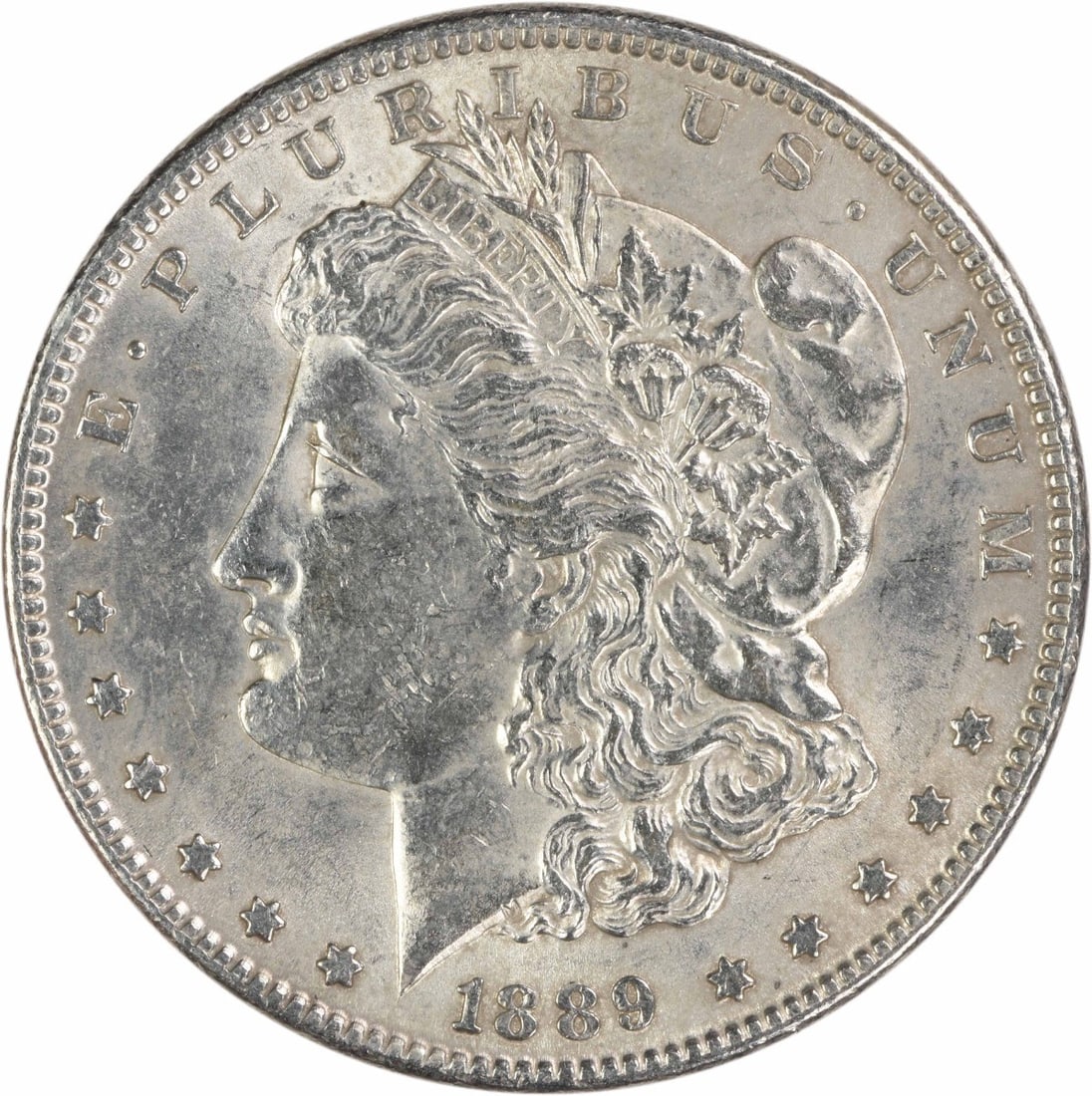 1889 Philadelphia Morgan Dollar AU 90 Percent Silver Uncertified Coin: 1889 Philadelphia Morgan Dollar AU 90 Percent Silver Uncertified Coin This 1889 Morgan Silver Dollar is an ungraded, circulated coin minted in Philadelphia. Composed of 90% silver and 10% copper, it w