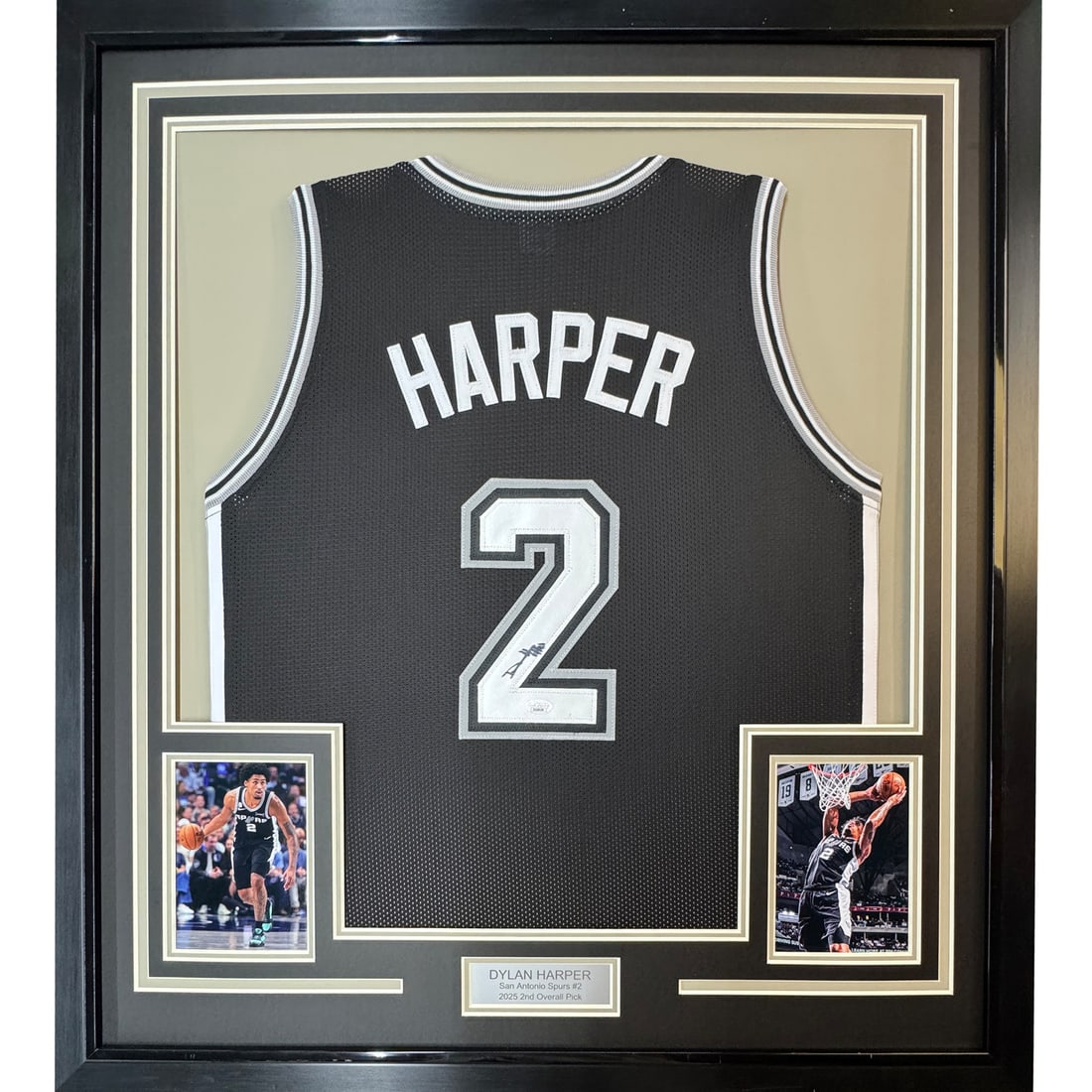 Framed Dylan Harper Autographed San Antonio Spurs Jersey JSA COA 35x39: Framed Dylan Harper Autographed San Antonio Spurs Jersey JSA COA 35x39 This professionally framed and matted item showcases an autographed black jersey of NBA athlete Dylan Harper, representing the Sa