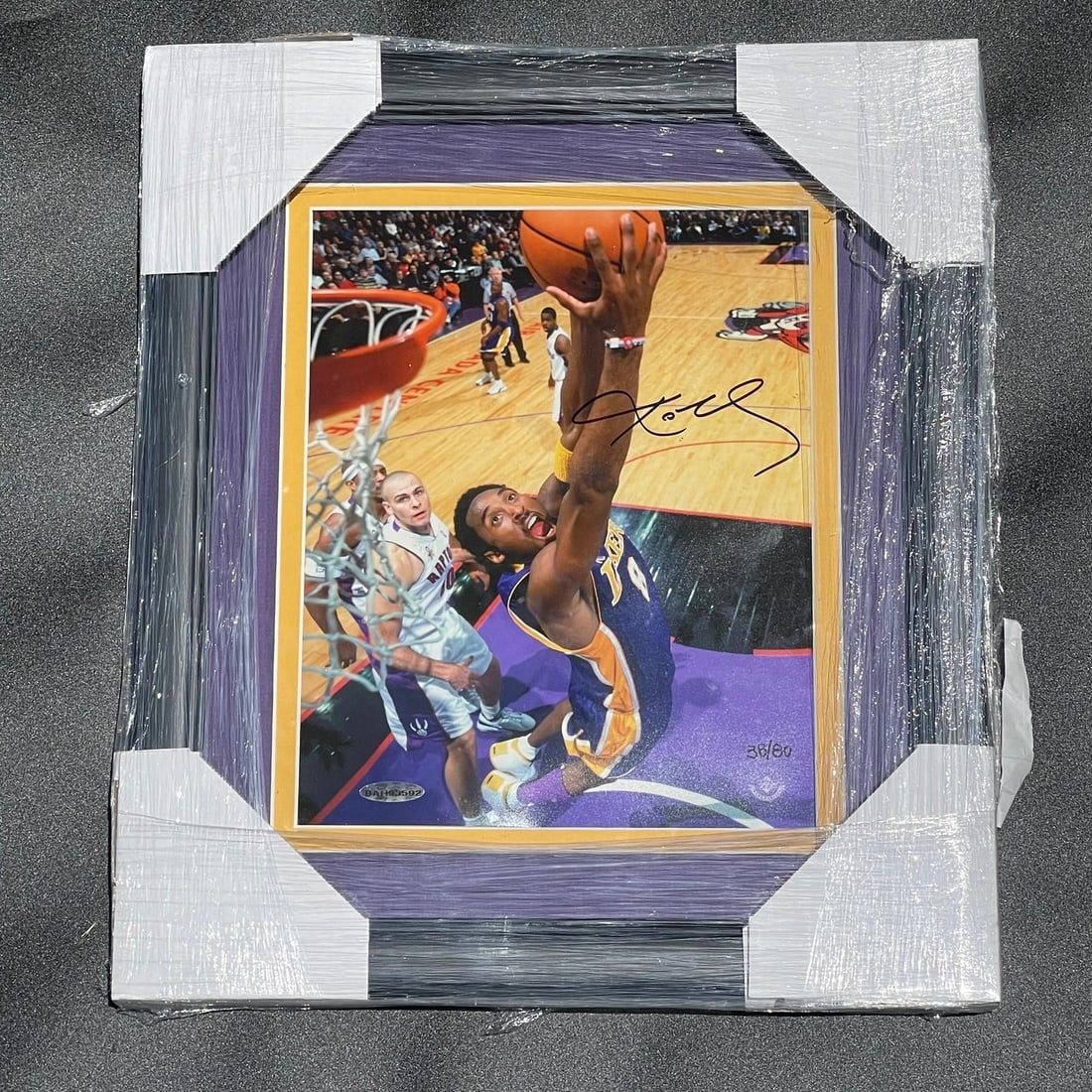Kobe Bryant Signed 8x10 Framed Photo with Upper Deck LOA: Kobe Bryant Signed 8x10 Framed Photo with Upper Deck LOA This is an original 8x10 framed photograph of the legendary basketball player Kobe Bryant, famously known as 'The Black Mamba.' The photo featu