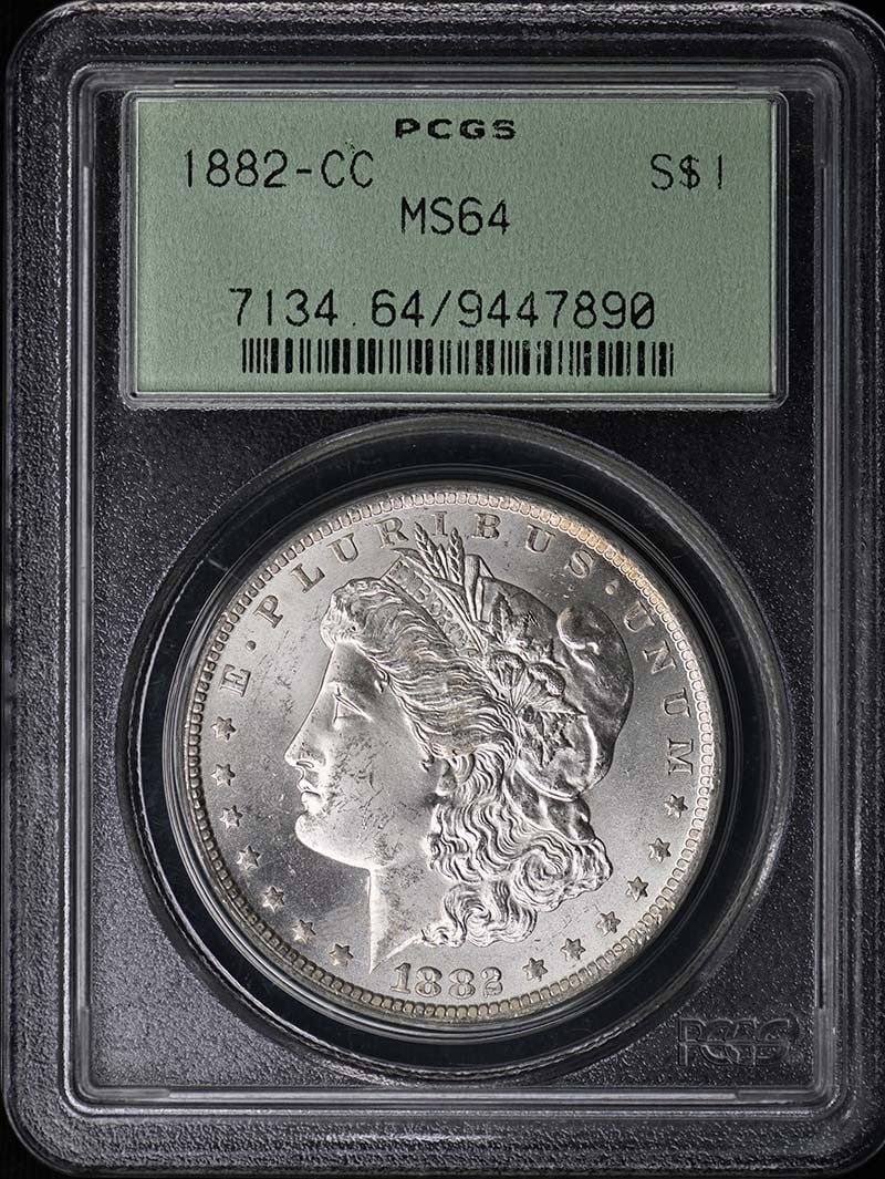 PCGS MS64 Carson City 1882 Morgan Silver Dollar Coin: PCGS MS64 Carson City 1882 Morgan Silver Dollar Coin This is an 1882-CC Morgan Dollar graded MS64 by PCGS. Minted in Carson City, this uncirculated silver dollar is a pre-owned collectible from the Un