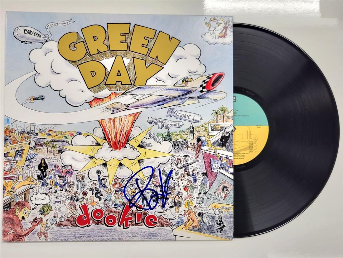 Green Day Dookie album cover autographed by Billie Joe Armstrong Beckett authenticated: Green Day Dookie album cover autographed by Billie Joe Armstrong Beckett authenticated This is an original Green Day 'Dookie' record album cover signed by Billie Joe Armstrong. The autograph has been