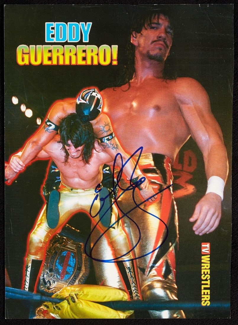 Eddy Guerrero Autographed Photo BAS Authenticated Wrestling: Eddy Guerrero Autographed Photo BAS Authenticated Wrestling This listing features an original full-page magazine photo of wrestling legend Eddie Guerrero, beautifully signed in blue Sharpie. The signa