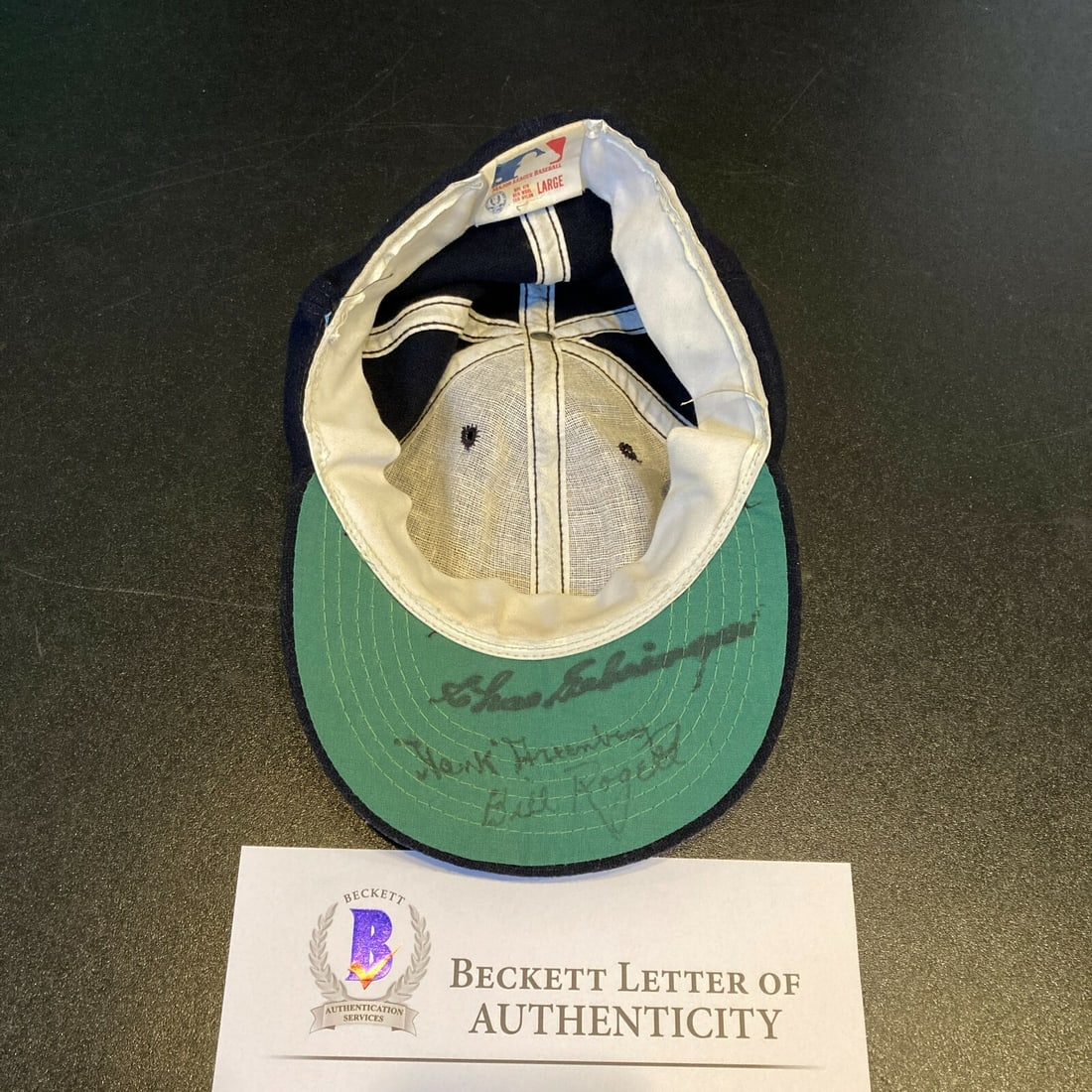 Detroit Tigers Cap Signed by Hank Greenberg Beckett Authenticated: Detroit Tigers Cap Signed by Hank Greenberg Beckett Authenticated This vintage Detroit Tigers baseball cap features signatures from Hank Greenberg, Charlie Gehringer, and Bill Rogell. The midnight nav