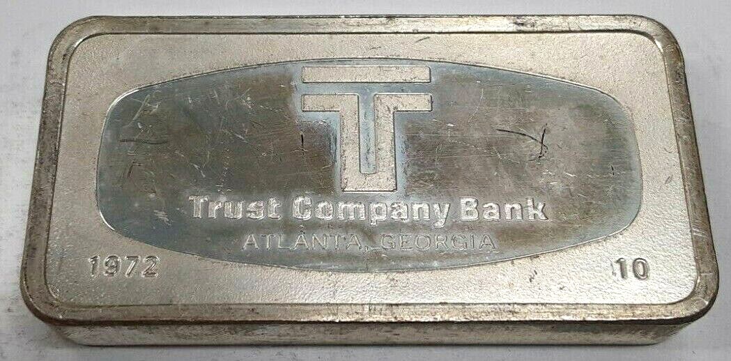Franklin Mint 1000 Grain Sterling Silver Ingot Trust Company Bank Atlanta #10: Franklin Mint 1000 Grain Sterling Silver Ingot Trust Company Bank Atlanta #10 This is a 1972 Franklin Mint 1000 grain sterling silver ingot featuring The Trust Company Bank of Atlanta, Georgia, design