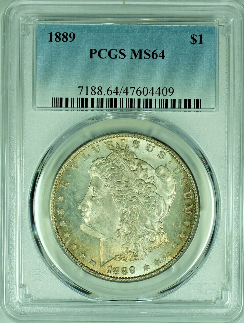 PCGS MS 64 1889 Morgan Dollar Semi-Prooflike Silver Toned Uncirculated Coin: PCGS MS 64 1889 Morgan Dollar Semi-Prooflike Silver Toned Uncirculated Coin This is an 1889 Morgan Silver Dollar from the United States, featuring a semi-proof like strike and attractive toning. Certi