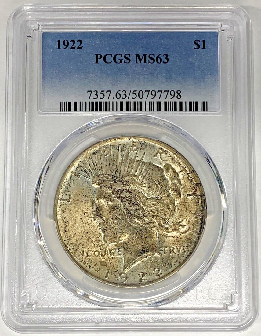 PCGS MS 63 1922 Peace Dollar Silver Coin With Toning: PCGS MS 63 1922 Peace Dollar Silver Coin With Toning This is a 1922 Peace Silver Dollar coin from the United States, featuring a toned finish. The coin is composed of silver, denominated at $1, and ce