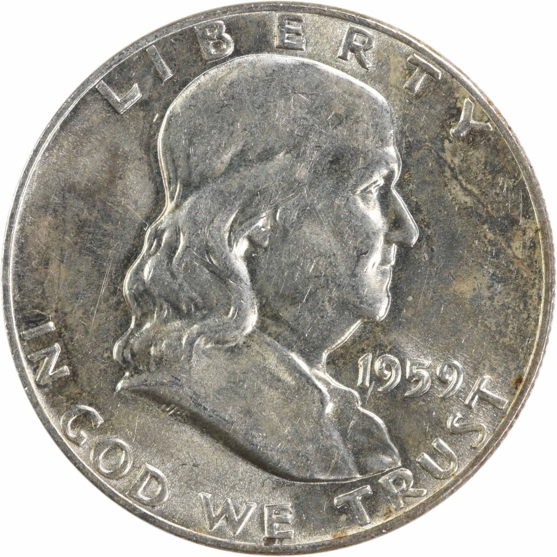 1959 AU Franklin 50C Uncertified Silver Coin from Philadelphia: 1959 AU Franklin 50C Uncertified Silver Coin from Philadelphia This 1959 Franklin Half Dollar is composed of 90% silver and 10% copper, minted in Philadelphia. The coin features the classic design by