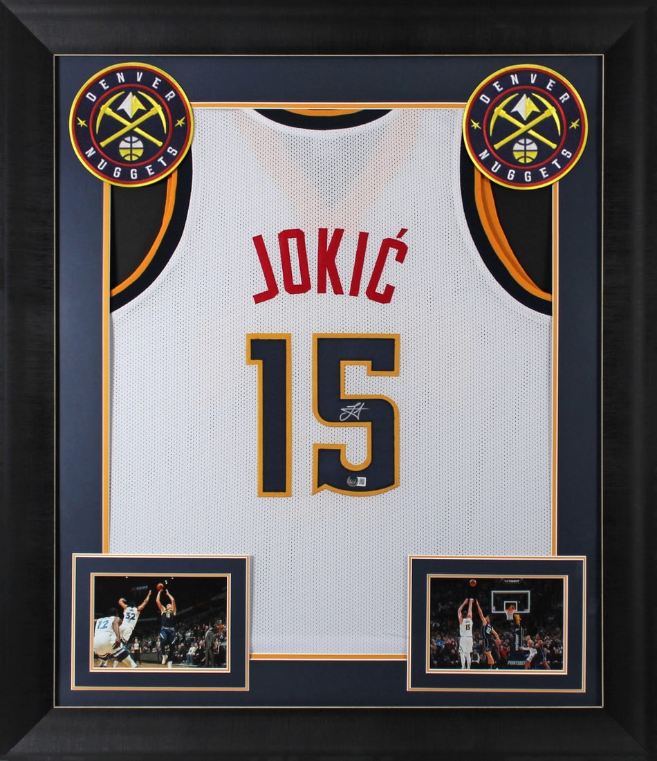 Framed White Jersey Signed by Nikola Jokic BAS Witnessed Authentic Denver Nuggets: Framed White Jersey Signed by Nikola Jokic BAS Witnessed Authentic Denver Nuggets This professionally framed white pro style jersey has been personally signed by Nikola Jokic of the Denver Nuggets. Th