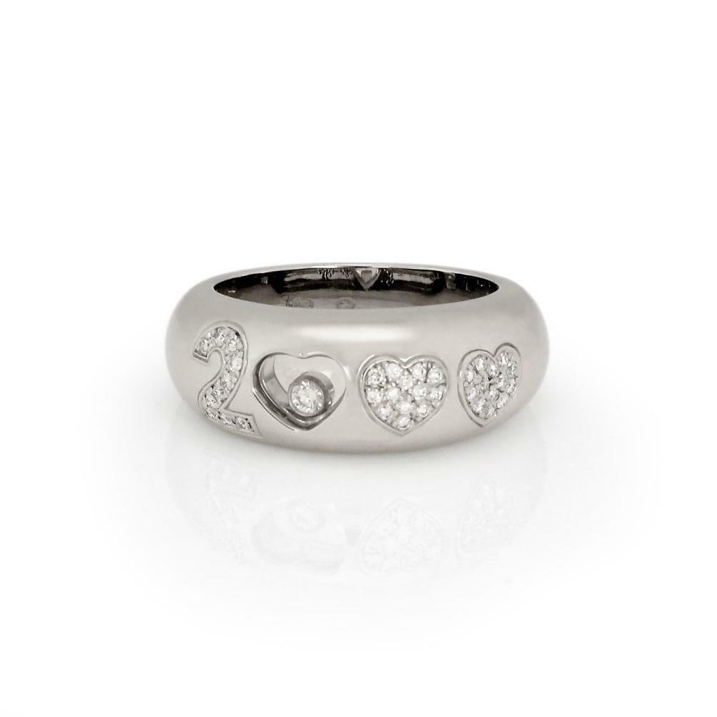 Chopard Happy Diamonds 2000 18k White Gold Ring with Floating Diamond: Chopard Happy Diamonds 2000 18k White Gold Ring with Floating Diamond Discover the elegance of this authentic Chopard band ring from the iconic Happy Diamonds collection. Crafted from luxurious 18k wh