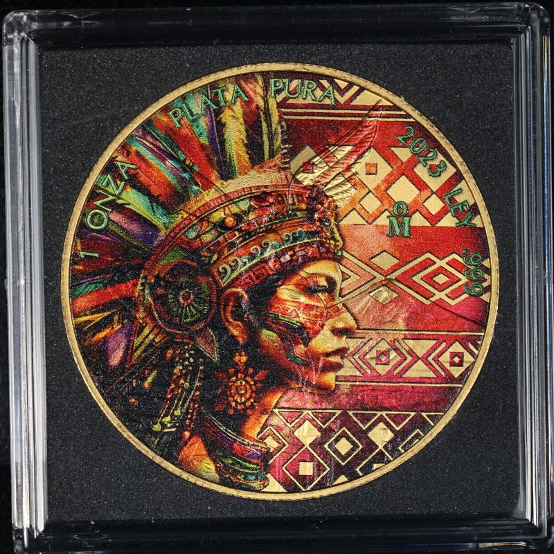 Colorized 2023 Silver Libertad Aztec Empire Woman 1 oz Coin from Mexico: Colorized 2023 Silver Libertad Aztec Empire Woman 1 oz Coin from Mexico This is a 2023 Mexico 1 Ounce Silver Libertad coin from the Aztec Empire series, featuring a colorized depiction of a woman. The