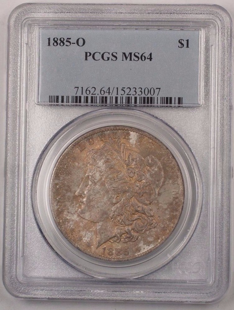 PCGS MS-64 1885-O Morgan Dollar Silver Toned New Orleans Mint: PCGS MS-64 1885-O Morgan Dollar Silver Toned New Orleans Mint This is an 1885-O Morgan Silver Dollar $1 coin from the United States, minted in New Orleans. The coin is composed of silver and is certif