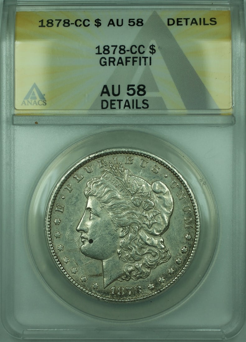 AU-58 ANACS 1878 Carson City Morgan Dollar Silver $1 with Graffiti: AU-58 ANACS 1878 Carson City Morgan Dollar Silver $1 with Graffiti This 1878-CC Morgan Silver Dollar is a $1 coin from the United States, minted in Carson City. Composed of silver with a fineness of 0