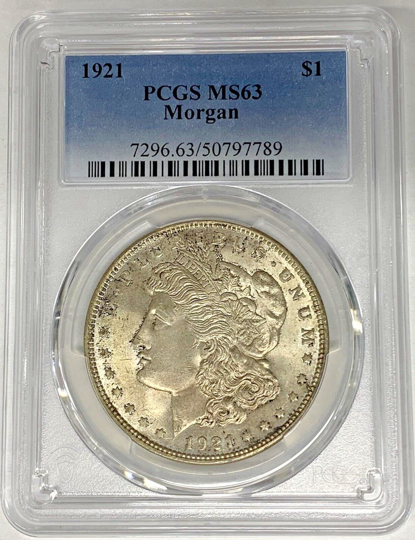 PCGS MS 63 1921 Morgan Dollar Silver Coin with Toning: PCGS MS 63 1921 Morgan Dollar Silver Coin with Toning This 1921 Morgan Silver Dollar coin features a toned finish and is graded MS 63 by PCGS. Struck in silver, this uncirculated coin originates from