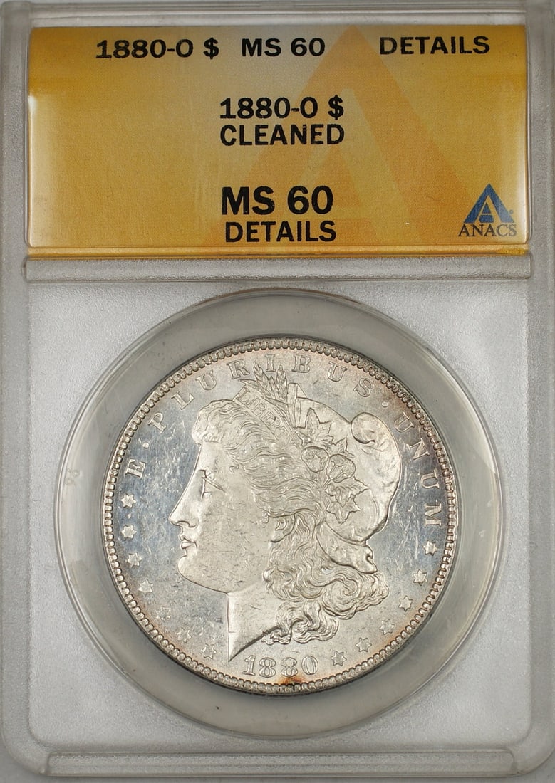 ANACS MS-60 Details 1880-O Silver Dollar Cleaned New Orleans Mint: ANACS MS-60 Details 1880-O Silver Dollar Cleaned New Orleans Mint This is an 1880-O Morgan Silver Dollar graded MS-60 Details by ANACS. The coin is composed of silver and was minted in New Orleans. It
