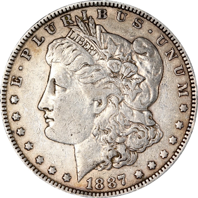 1887 Philadelphia Morgan Dollar Silver VAM 25A Donkey Tail Variety: 1887 Philadelphia Morgan Dollar Silver VAM 25A Donkey Tail Variety This 1887-P Morgan Silver Dollar features the VAM 25A 'Donkey Tail' variety. The coin is composed of silver with a fineness of 0.9 an