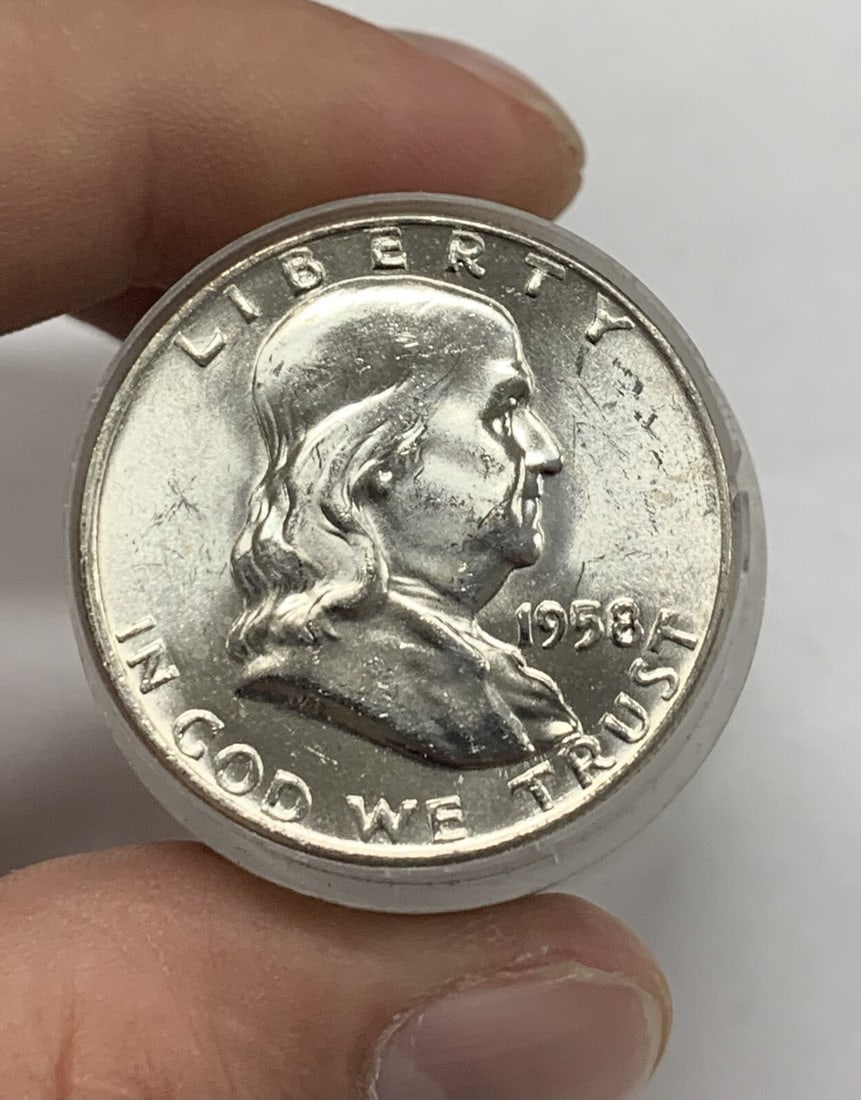 Roll of 20 Uncirculated 1958-D Franklin Silver Half Dollars: Roll of 20 Uncirculated 1958-D Franklin Silver Half Dollars This is a roll of twenty 1958-D Franklin Half Dollar coins, each with a denomination of 50 cents. The coins are uncirculated and retain thei