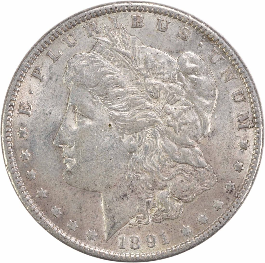 1891 Morgan Silver Dollar AU Uncertified 90% Silver Coin: 1891 Morgan Silver Dollar AU Uncertified 90% Silver Coin This 1891 Morgan Silver Dollar is a classic collectible coin featuring the renowned design by George T. Morgan. It is classified as About Uncir
