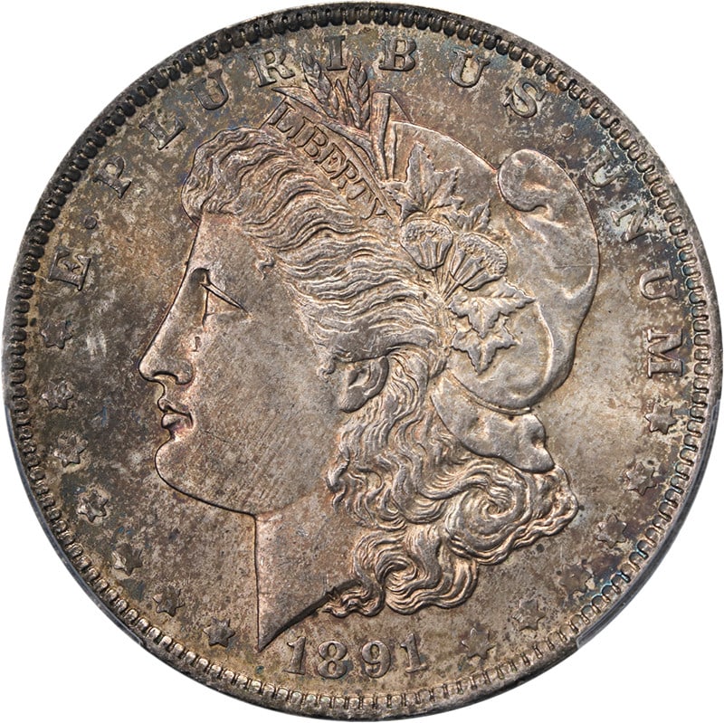 PCGS MS64 1891-O Morgan Dollar Silver US Coin Uncirculated: PCGS MS64 1891-O Morgan Dollar Silver US Coin Uncirculated This original 1891-O Morgan Silver Dollar is graded PCGS MS64, featuring decent eye appeal, a nice strike, and mottled toning. The coin exhib