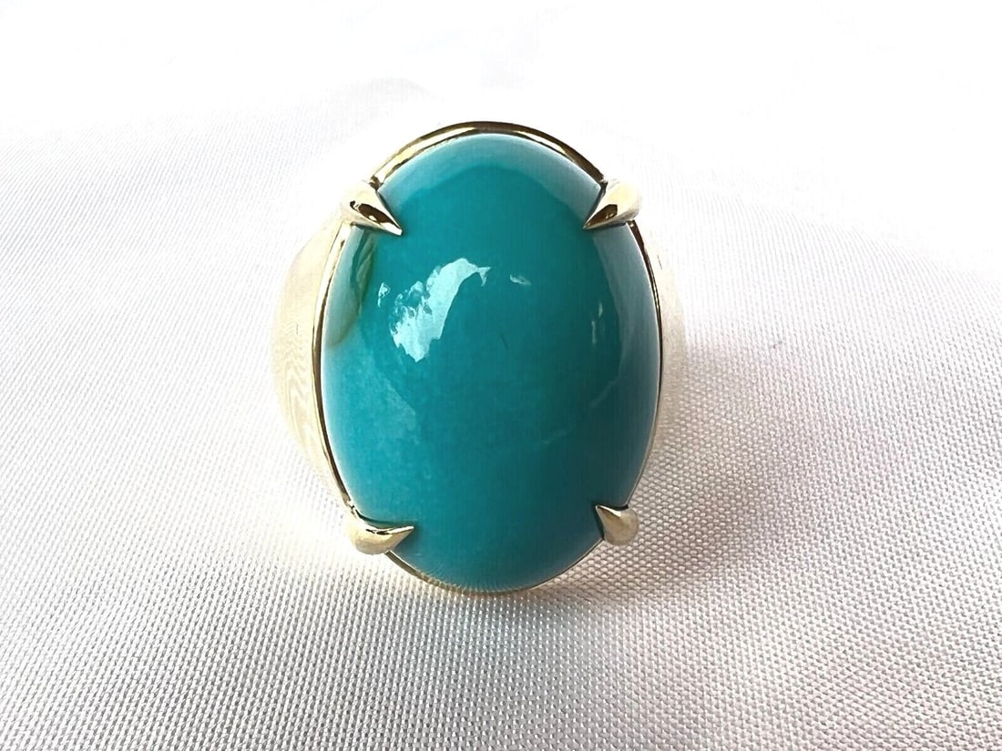 1960s 18K Gold Turquoise Ring Size 12 Persian Design: 1960s 18K Gold Turquoise Ring Size 12 Persian Design This stunning 1960's Persian turquoise ring is crafted from 18K yellow gold and showcases a remarkable large turquoise stone. The ring is size 12 a