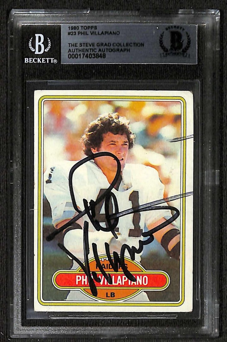 Autographed 1980 Topps #23 Football Card Phil Villapiano Beckett Authenticated: Autographed 1980 Topps #23 Football Card Phil Villapiano Beckett Authenticated This is an original 1980 Topps #23 sports trading card featuring Oakland Raiders linebacker Phil Villapiano. The card has