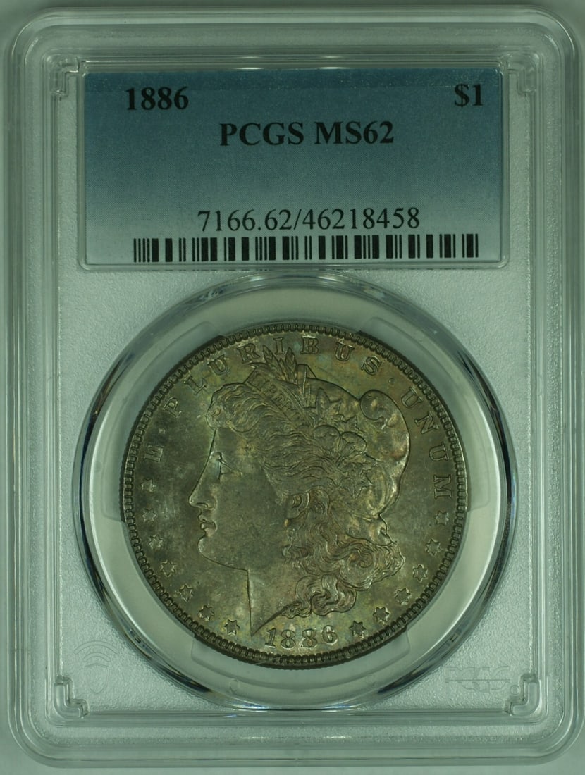 PCGS MS-62 1886 Morgan Silver Dollar With Toning: PCGS MS-62 1886 Morgan Silver Dollar With Toning This is an 1886 Morgan Silver Dollar graded MS-62 by PCGS, featuring attractive toning. The coin is uncirculated and was minted in Philadelphia. It is