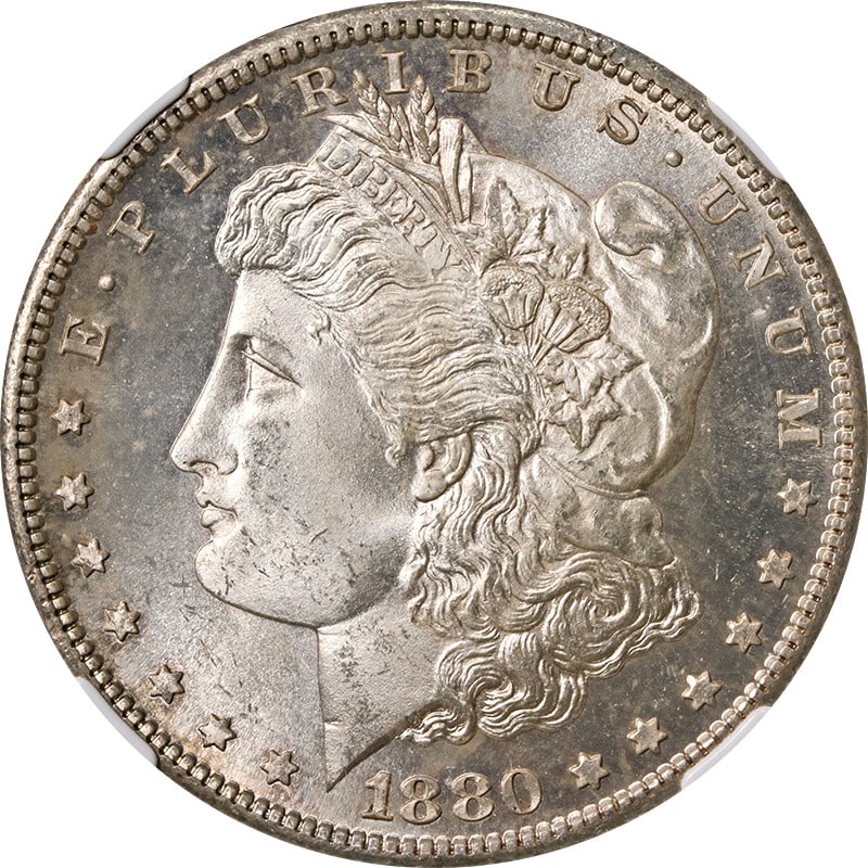 1880-S Morgan Silver Dollar NGC MS66 with Toning: 1880-S Morgan Silver Dollar NGC MS66 with Toning This 1880-S Morgan Silver Dollar is graded NGC MS66, showcasing exceptional quality in uncirculated condition. The coin is composed of 90% silver and f