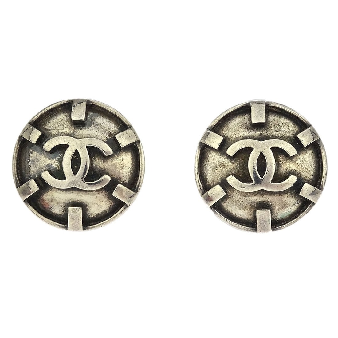 Chanel 96P Silver Plated Button Clip-On Earrings: Chanel 96P Silver Plated Button Clip-On Earrings Add a touch of elegance to your ensemble with these Chanel Button Earrings. Designed in a classic round shape, these clip-on earrings feature a stylish
