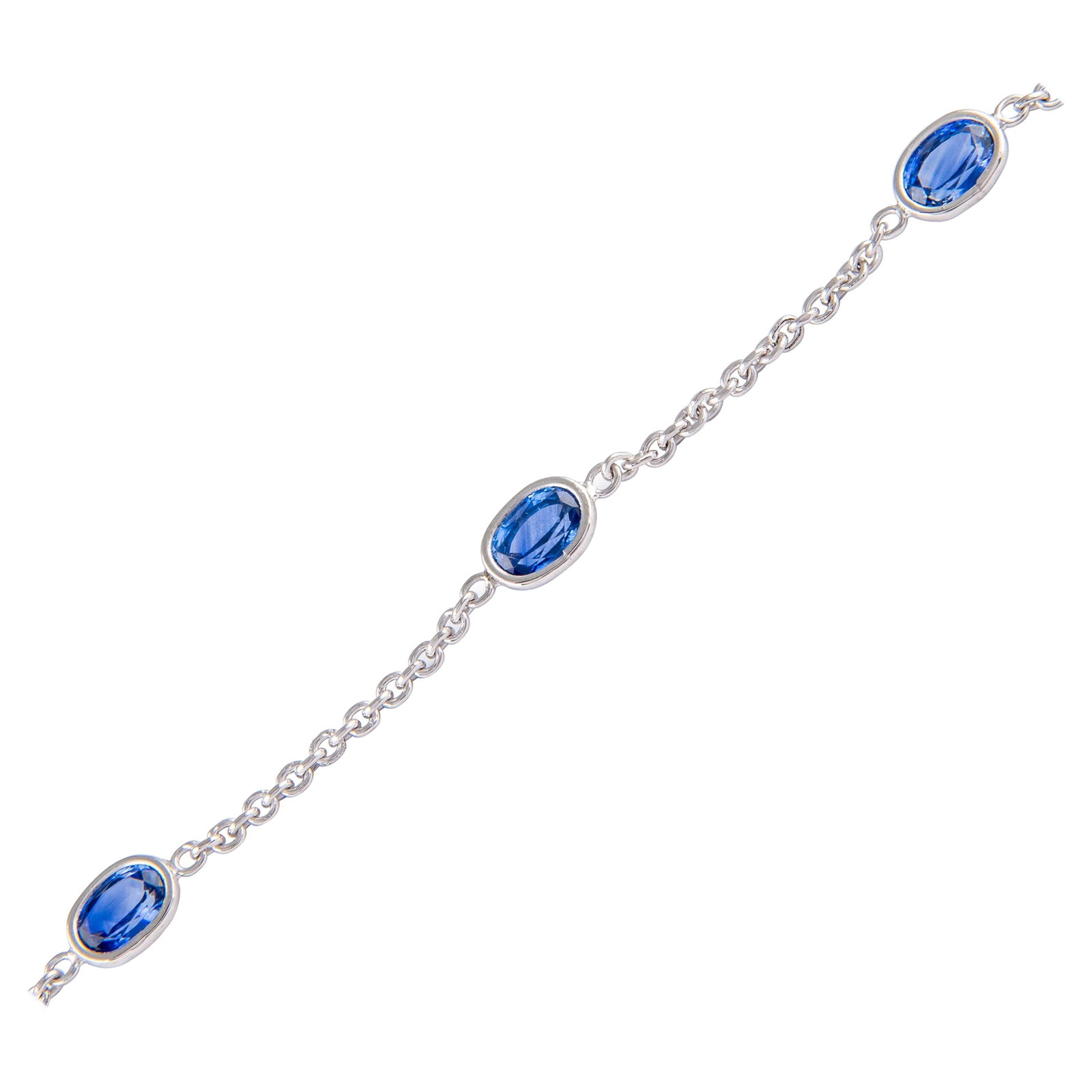 4.76ct Oval Sapphire Bracelet 18k White Gold Modern Design: 4.76ct Oval Sapphire Bracelet 18k White Gold Modern Design This exquisite bracelet features five stunning oval-cut sapphires totaling 4.76 carats, elegantly set in handcrafted bezels of 18k white gold