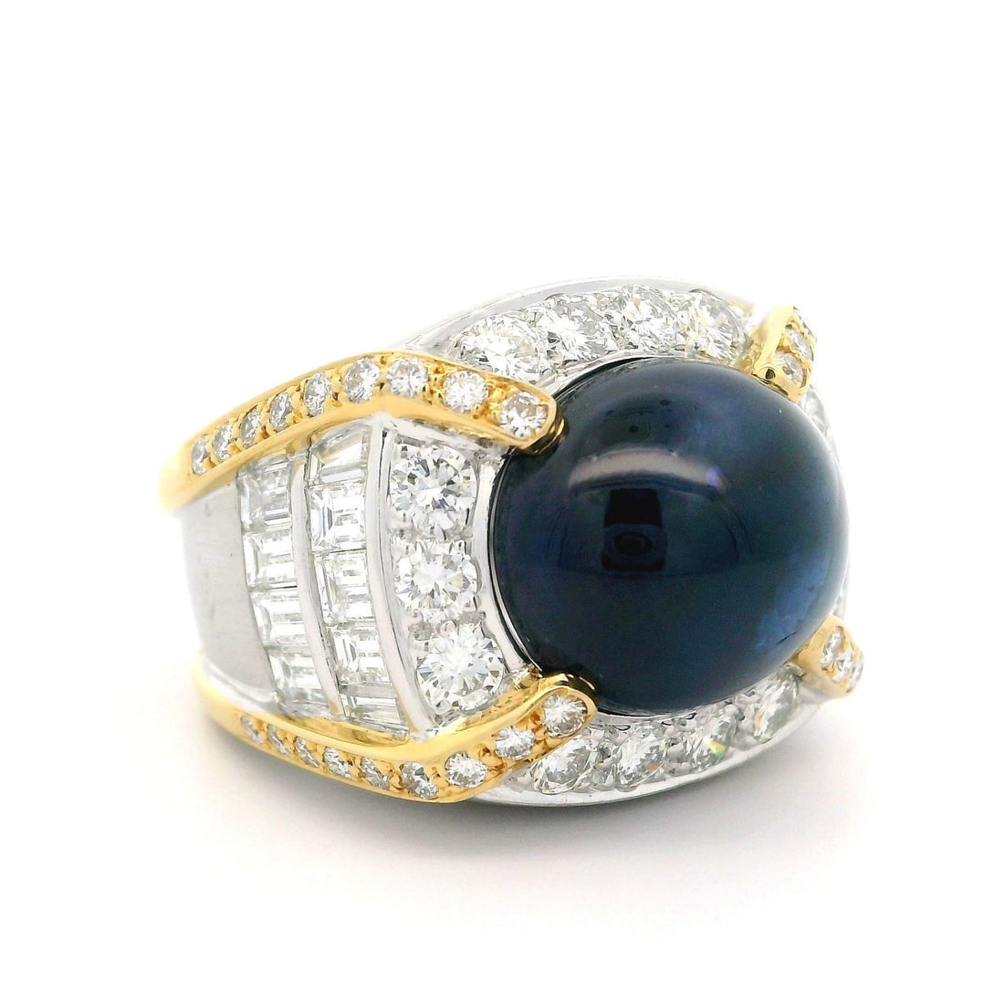 GIA Certified 21.95ct Oval Sapphire Diamond Gold Statement Ring: GIA Certified 21.95ct Oval Sapphire Diamond Gold Statement Ring This stunning statement ring showcases a large, natural oval cabochon sapphire, set in solid yellow gold and adorned with an exquisite a