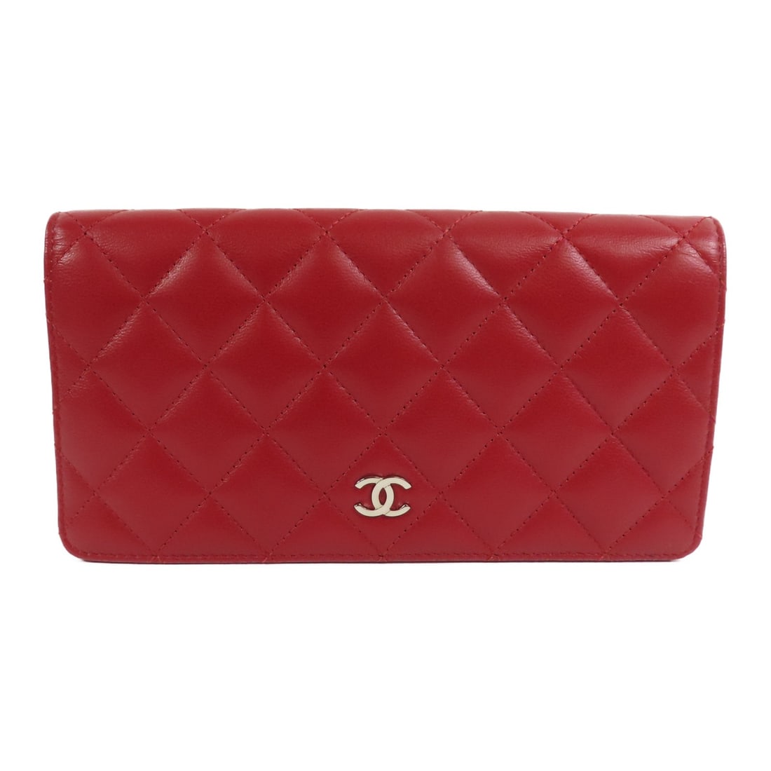 Red Lambskin Bifold Wallet by Chanel with Silver CC Hardware: Red Lambskin Bifold Wallet by Chanel with Silver CC Hardware This CHANEL CC long wallet features a bifold design crafted from luxurious red lambskin leather. Made in France, it showcases the signature