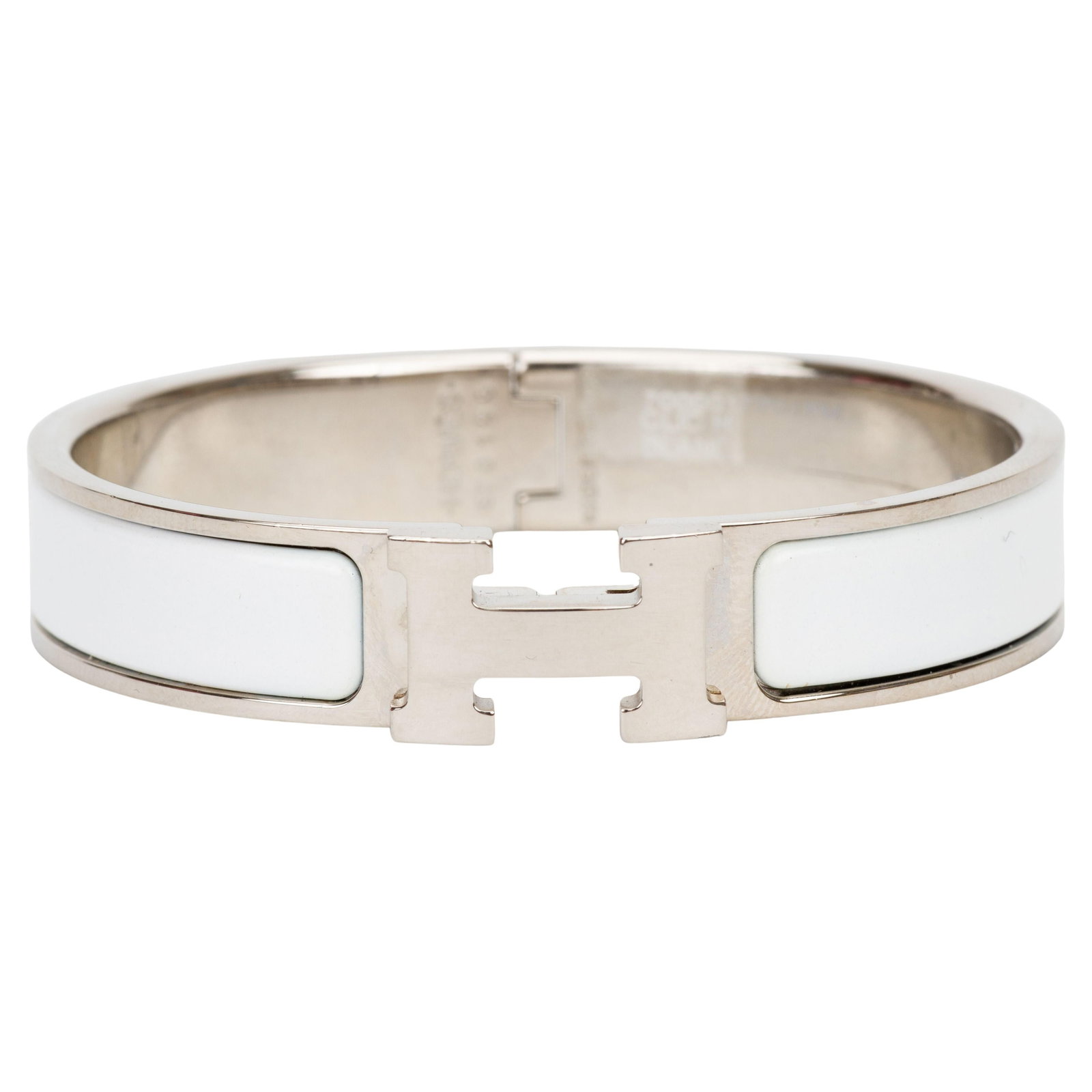 Hermes Clic H White Enamel Bracelet 2022 France: Hermes Clic H White Enamel Bracelet 2022 France Introducing the Hermes White Palladium Clic "H" Bracelet, a stunning piece crafted from enamel. This narrow bracelet features a sleek white finish paire