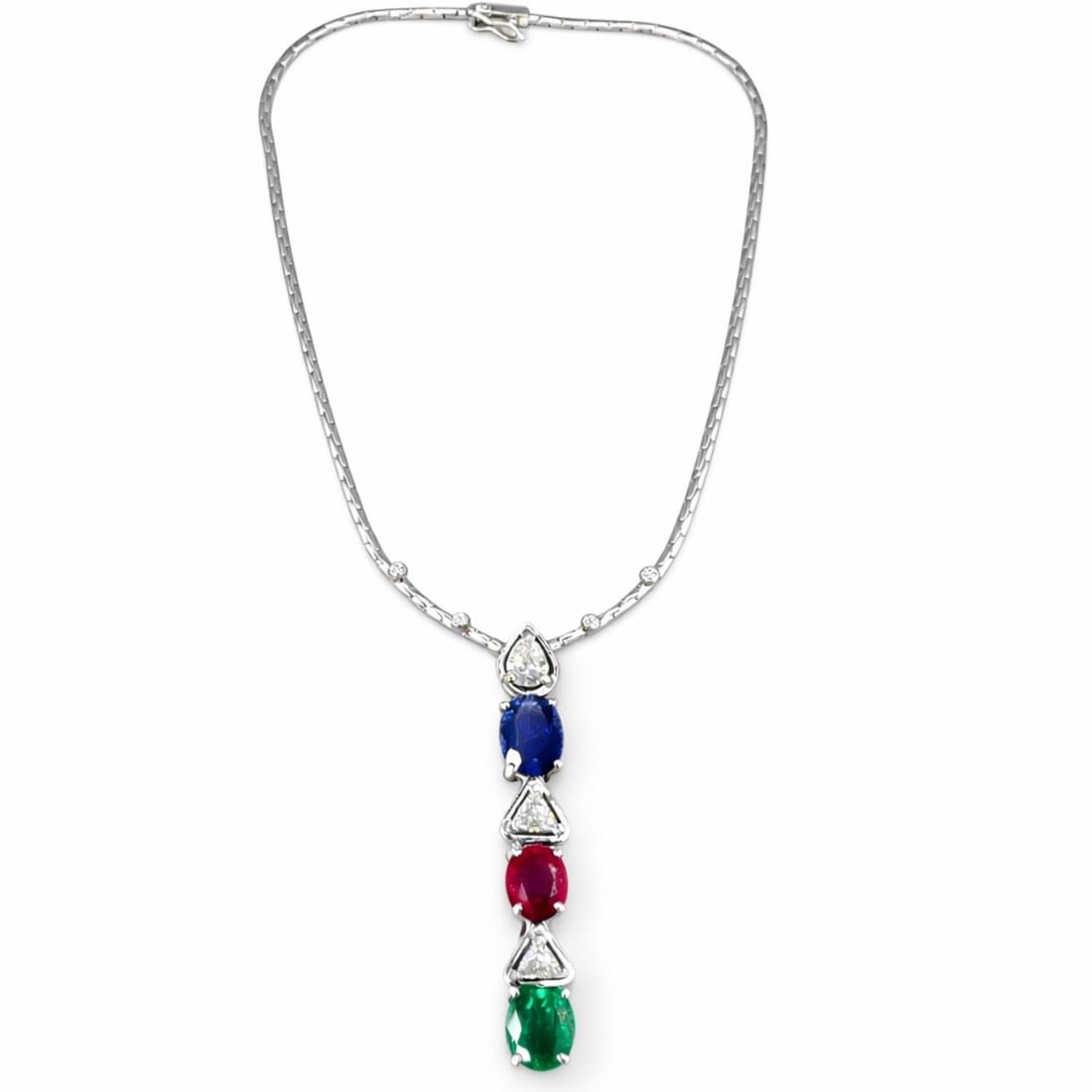 Necklace in 18K White Gold with Sapphire Ruby Emerald and Diamond Accents 16 Inch: Necklace in 18K White Gold with Sapphire Ruby Emerald and Diamond Accents 16 Inch This elegant necklace is crafted in 18K white gold and showcases an exquisite combination of gemstones. It features ap
