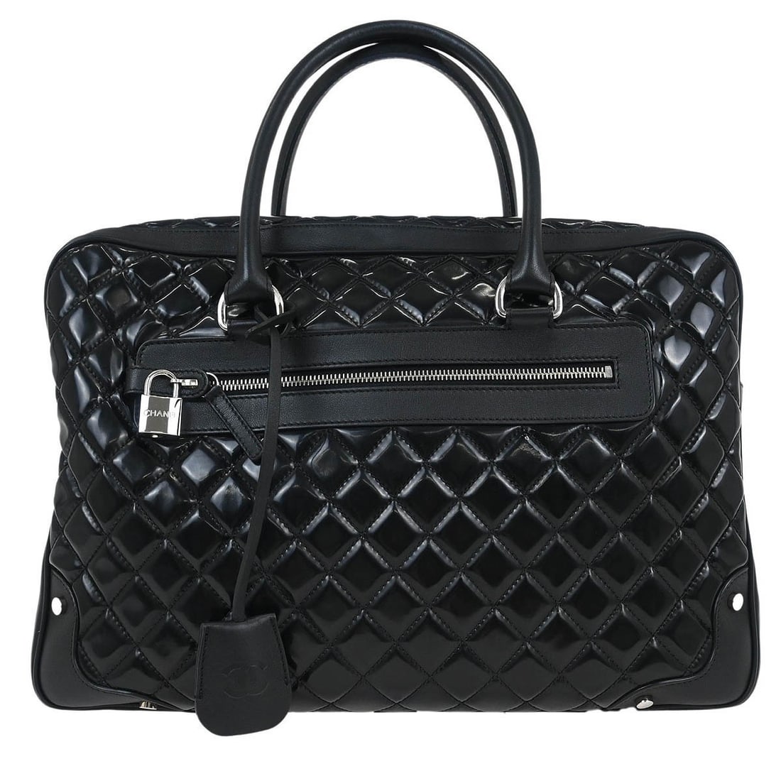 Chanel Black Patent Leather Duffle Handbag with Inner Pockets: Chanel Black Patent Leather Duffle Handbag with Inner Pockets This Chanel Black Patent Leather Duffle Handbag is a stylish and versatile accessory, perfect for casual outings. Crafted from high-qualit