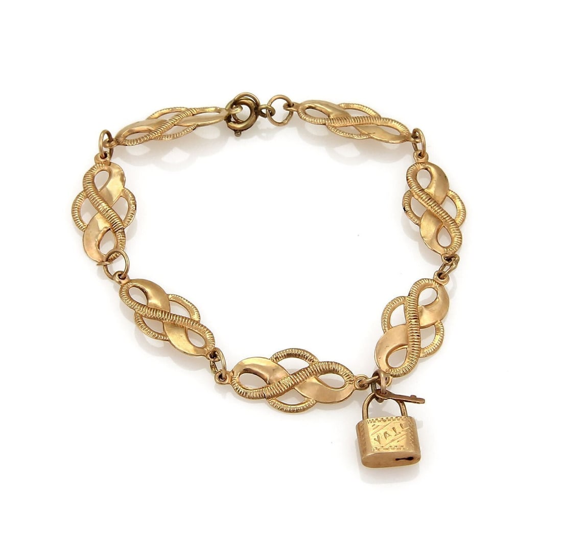 14k Rose Gold Victorian Bracelet with Padlock Charm and Curved Fancy Links: 14k Rose Gold Victorian Bracelet with Padlock Charm and Curved Fancy Links This Victorian bracelet features an intricate curved link design with a padlock charm, crafted from 14k rose gold. The piece