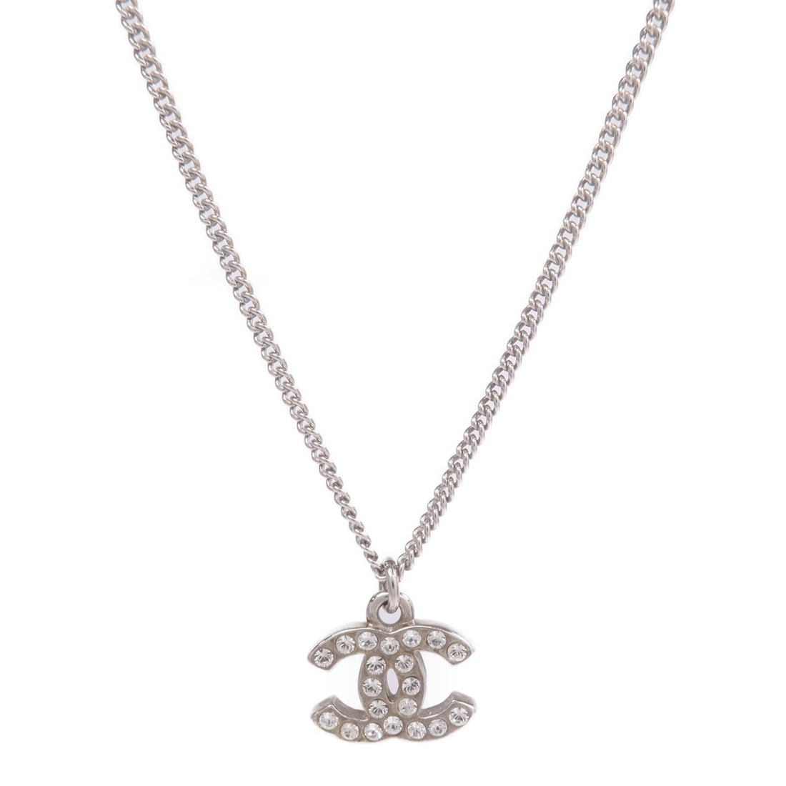 Chanel Silver Tone CC Pendant Necklace for Women: Chanel Silver Tone CC Pendant Necklace for Women This CHANEL CC necklace features a silver-tone metal design, crafted for women. The necklace does not include any stones and is made in France. It is i