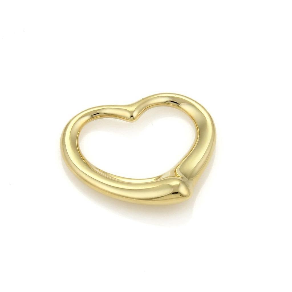 Tiffany & Co. Elsa Peretti 18k Yellow Gold Open Heart Pendant: Tiffany & Co. Elsa Peretti 18k Yellow Gold Open Heart Pendant This exquisite pendant, designed by Elsa Peretti for Tiffany & Co., showcases a medium-sized open heart shape that beautifully captures el