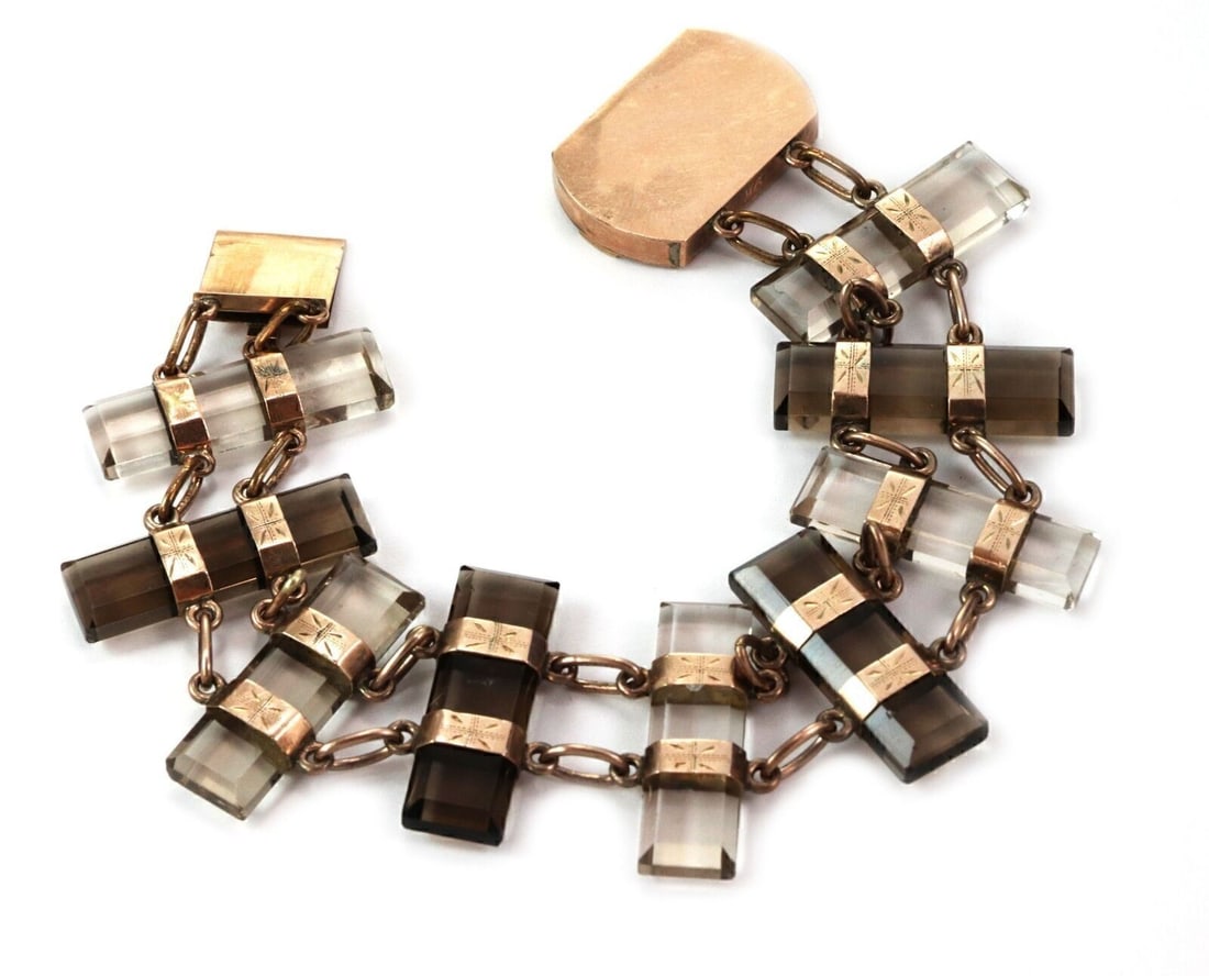 Antique 9k Rose and Yellow Gold Bar Link Bracelet With Smoky and Clear Quartz: Antique 9k Rose and Yellow Gold Bar Link Bracelet With Smoky and Clear Quartz This vintage bracelet showcases alternating smoky and clear quartz gemstones set in a stylish bar link design. Crafted fro