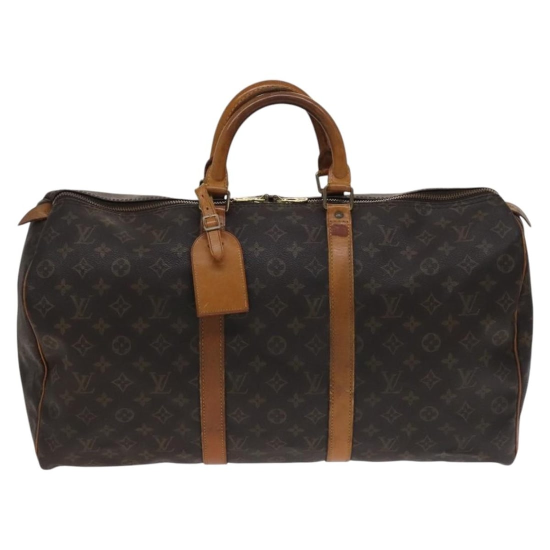 Keepall Travel Bag in Monogram Canvas by Louis Vuitton: Keepall Travel Bag in Monogram Canvas by Louis Vuitton This Louis Vuitton Keepall bag features the iconic Monogram canvas design in brown. Crafted for unisex use, the bag displays signs of wear, inclu
