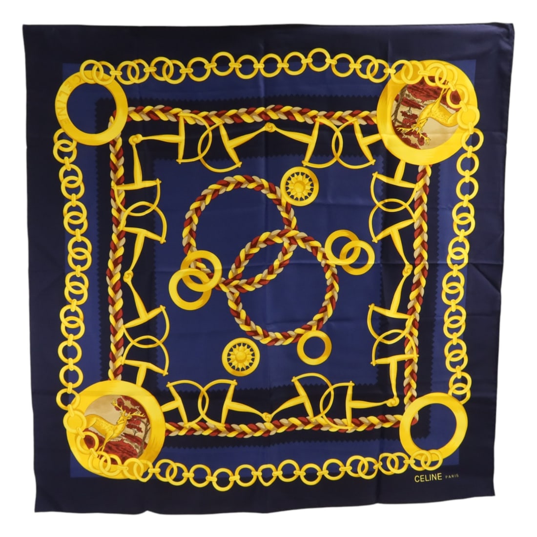 Celine Silk Scarf in Navy Gold and Red Pattern: Celine Silk Scarf in Navy Gold and Red Pattern This CELINE scarf features a luxurious silk construction in a navy, gold, and red color palette. Designed for women, it offers a classic look and soft fe