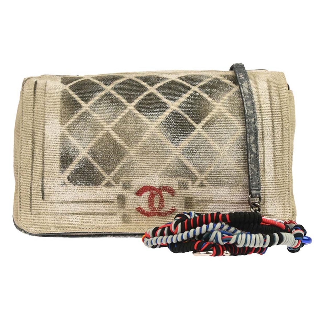 Chanel Boy Medium Square Shoulder Bag in Beige Canvas with Graffiti Design: Chanel Boy Medium Square Shoulder Bag in Beige Canvas with Graffiti Design This CHANEL Boy shoulder bag features a beige canvas exterior with a graffiti-inspired design and quilted accents. It is craf