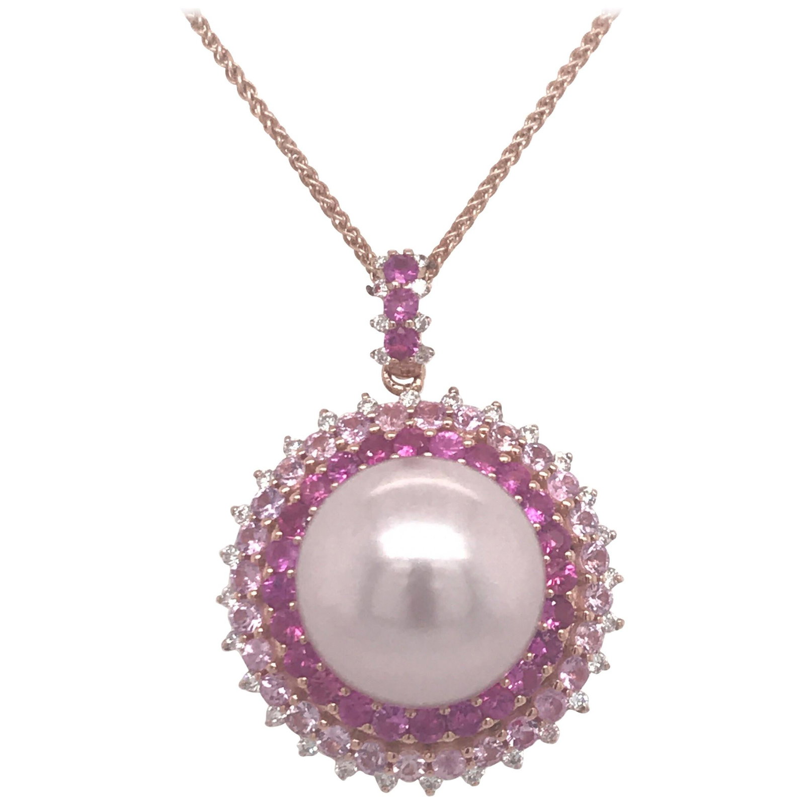 Harbor Diamonds 18K Rose Gold Pink Sapphire Pearl Pendant Necklace: Harbor Diamonds 18K Rose Gold Pink Sapphire Pearl Pendant Necklace This exquisite pendant necklace is crafted in 18K rose gold and showcases a stunning pink freshwater pearl, measuring 13-14 mm, as it