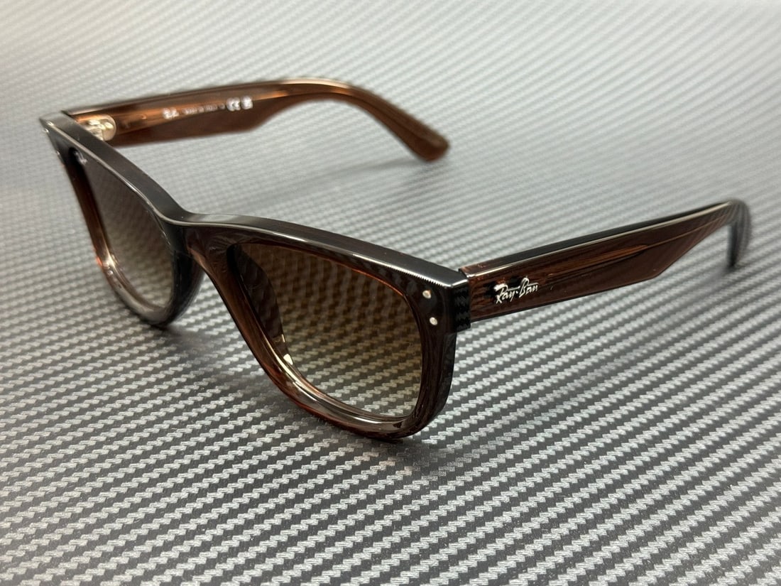 Ray-Ban RBR0502S 6709CB Unisex Transparent Brown Gradient Sunglasses: Ray-Ban RBR0502S 6709CB Unisex Transparent Brown Gradient Sunglasses Elevate your eyewear collection with these stylish Ray-Ban RBR0502S 6709CB sunglasses, showcasing a contemporary transparent brown