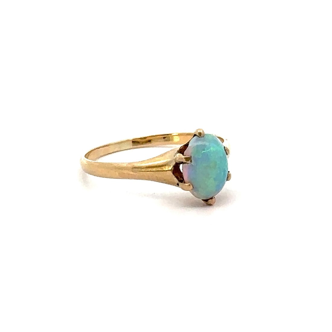 Antique Victorian 12k Yellow Gold 0.61ctw Blue Opal Solitaire Ring: Antique Victorian 12k Yellow Gold 0.61ctw Blue Opal Solitaire Ring This exquisite Antique Victorian ring features a stunning 0.61 carat natural genuine opal, elegantly set in a prong setting. The oval