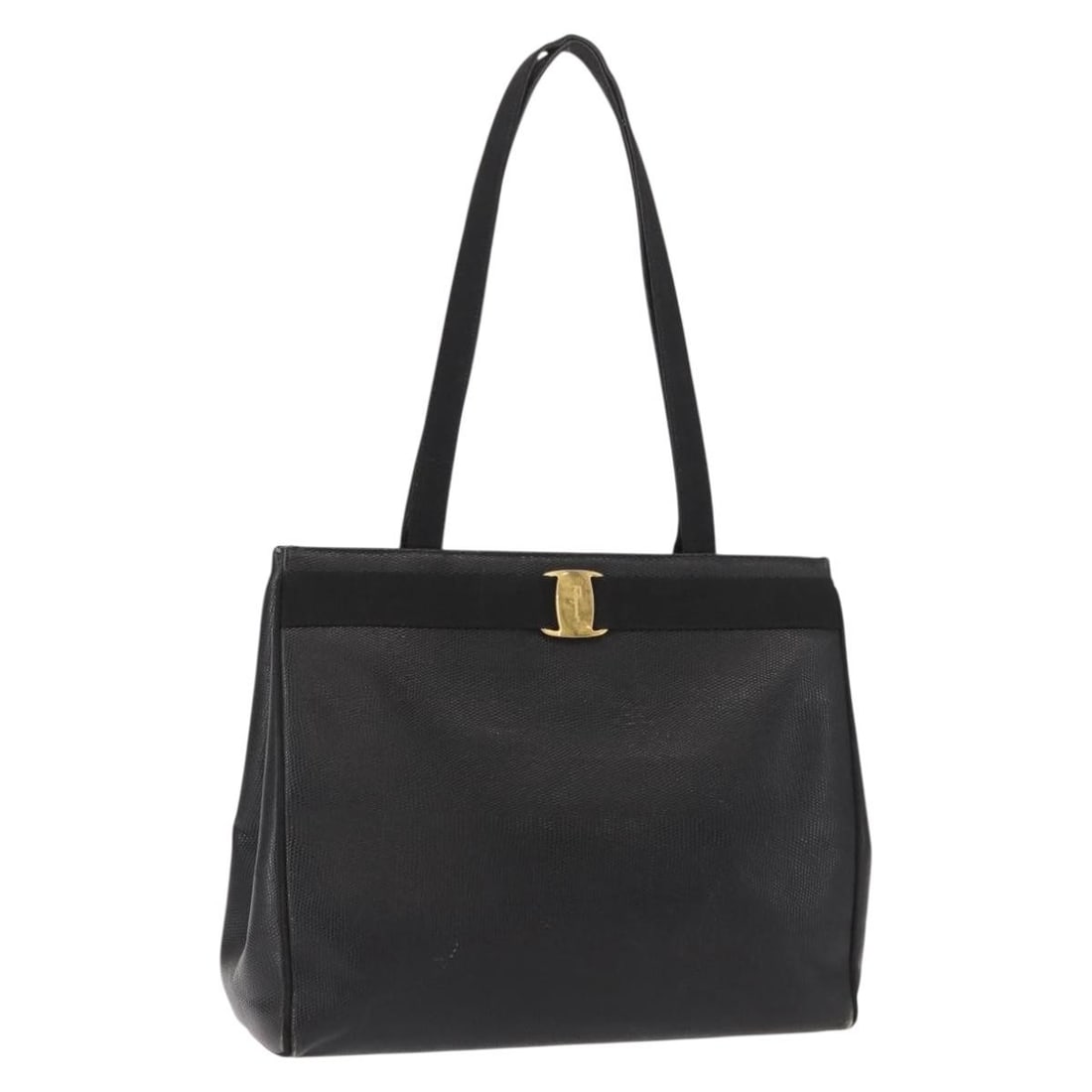 Black Leather Vala Tote by Salvatore Ferragamo Italy: Black Leather Vala Tote by Salvatore Ferragamo Italy This Salvatore Ferragamo Vala tote is crafted from black leather and designed for women. It features a spacious interior, metal fittings, and a cla