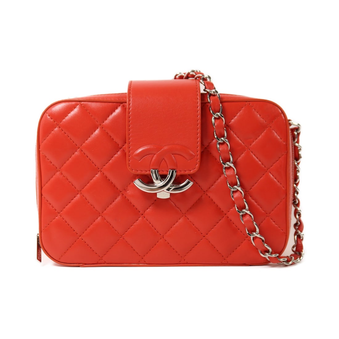 Red Lambskin Leather Chanel Shoulder Bag with Silver Chain CC Logo: Red Lambskin Leather Chanel Shoulder Bag with Silver Chain CC Logo This Chanel shoulder bag is crafted from red lambskin leather and features the signature CC logo with silver-tone hardware. The bag o